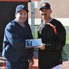 Kip Young, left, is presented a plaque by WHS baseball head coach Chris Veidt.  (HCP Photos/Stephen Forsha)