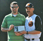 Ryan Barnett, left, is presented a plaque by WHS baseball head coach Chris Veidt.